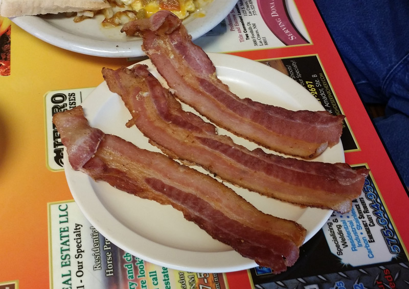 Three slices of American bacon