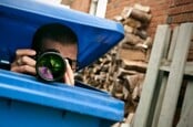 Spy hides in dustbin, lifts lid to take photograph