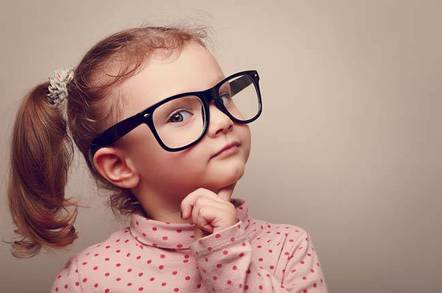 Red-haired child in glasses looks thoughtful. Image via Shutterstock - Copyright: Sofi photo