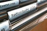 Files in manager's desk drawers: manila folder marked Redundancy Plan. Image via shutterstock