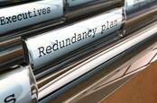 Files in manager's desk drawers: manila folder marked Redundancy Plan. Image via shutterstock