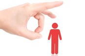 A large hand flicks an icon of a little red man. Image via shutterstock (Lasse Kristensen)