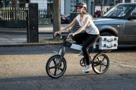 Woman rides a Ford modePro electric bike