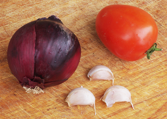 One onion, one tomato and three cloves of garlic