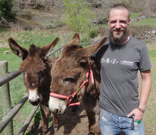 Matthew with our new shirt and two donkeys