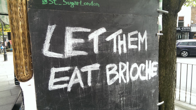 A sign in Roman Road market reading 'Let them eat brioche'