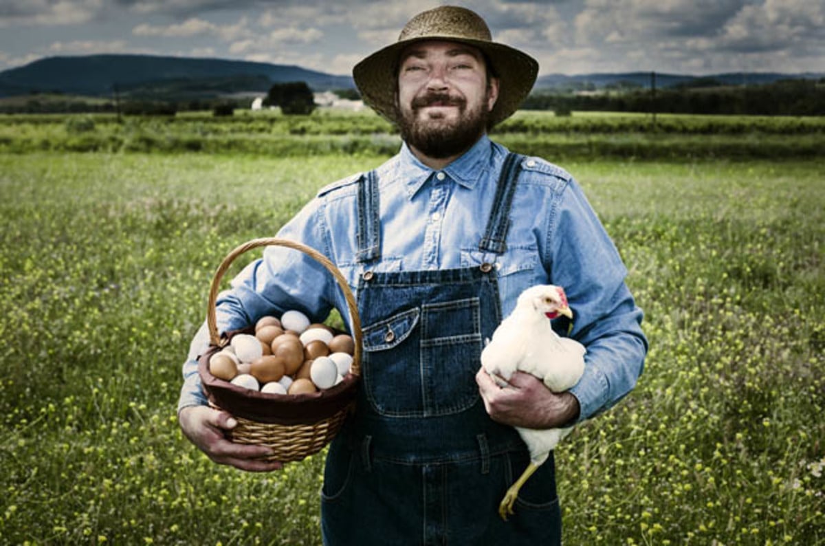 free_range_chicken_and_farmer_photo_via_shutterstock