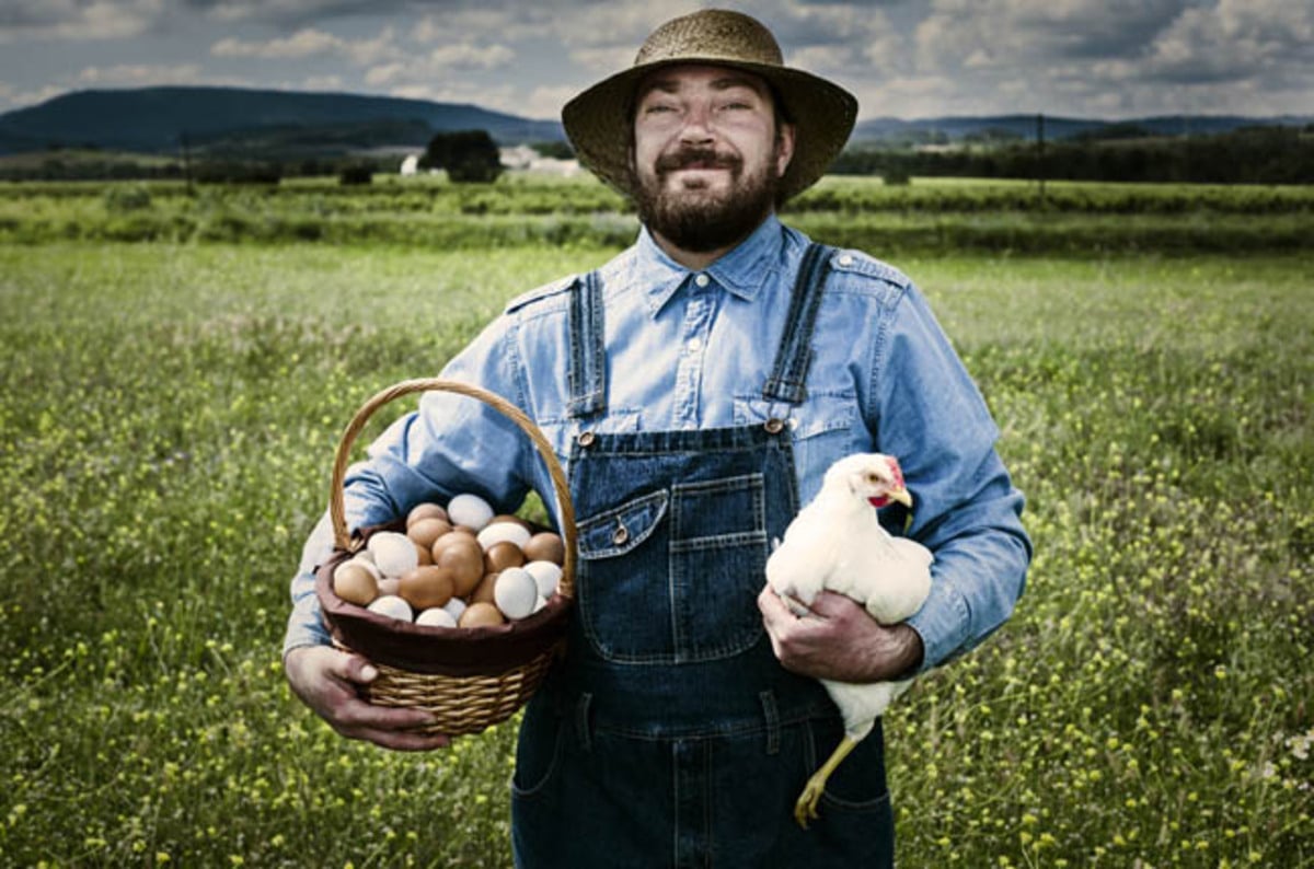 free_range_chicken_and_farmer_photo_via_