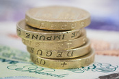 Old pound coins in a stack