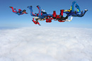 Parachutists and cloud image via Shutterstock