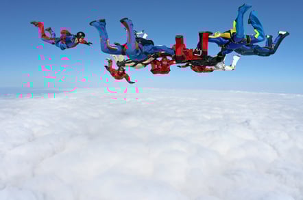 Parachutists and cloud image via Shutterstock