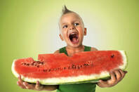 Boy slurps watermelon. Credit: Shutterstock