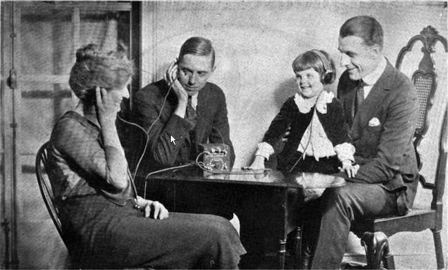 A family listening to a crystal radio set