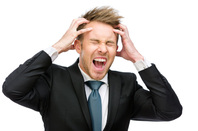 Shounting man in suit image via Shutterstock