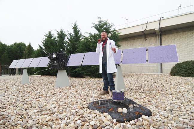 Matt poses with a model of the Rosetta spacecraft