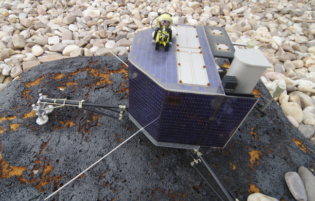 Our plucky Playmonaut atop a model of the Philae lander