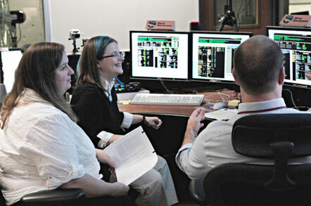 New Horizons flight controllers Sarah Bucior, Katie Bechtold and George Lawrence monitor data confirming that the Pluto-bound spacecraft had exited hibernation. Pic: NASA