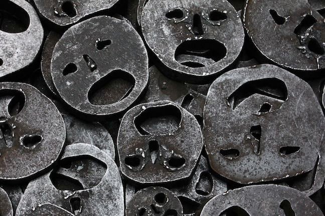 collection of metal masks cut with smiley faces