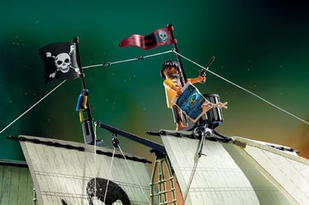 Detail from the pirate ship box, showing the offending figure with pistol and map