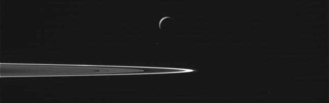 Enceladus and Saturn's rings. Pic: NASA/JPL-Caltech