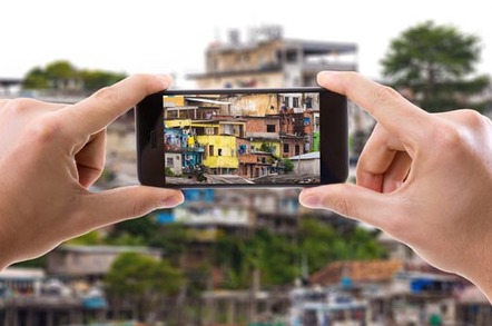 Hand holding smartphone taking picture in Manaus, Brazil. Picture by Filipe Frazao via Shutterstock