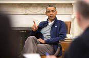 Barack Obama sitting, talking
