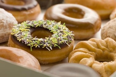 BOX OF ASSORTED DOUGHNUTS (AND A CRONUT). Photo by Shutterstock