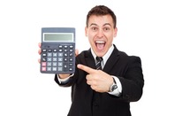 Grinning man in suit points at a calculator meaningfully. Pic via Shutterstock