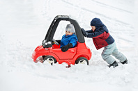 Kids car snow, image via Shutterstock