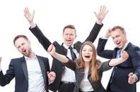 Happy business people celebrate. Photo by Shutterstock