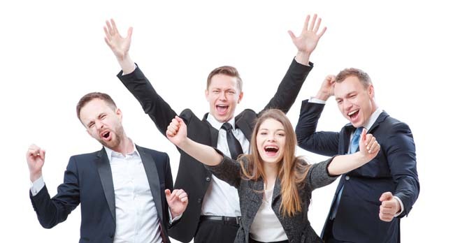 Happy business people celebrate. Photo by Shutterstock