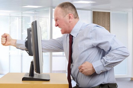 Furious man punches monitor and puts fist clear through it. Pic by Shutterstock