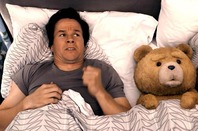 Mark Wahlberg and his come-to-life teddy bear in bed in the movie Ted. Copyright: Universal Pictures