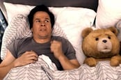 Mark Wahlberg and his come-to-life teddy bear in bed in the movie Ted. Copyright: Universal Pictures