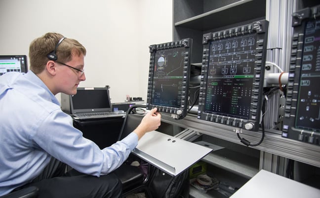 An engineer evaluates Orion’s display and control system. Pic NASA