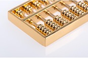 gold abacus via shutterstock