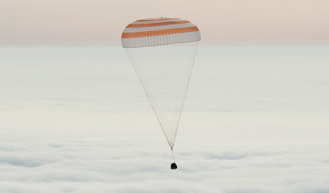 The Soyuz capsule descending under its parachute this morning. Pic: NASA/Bill Ingalls