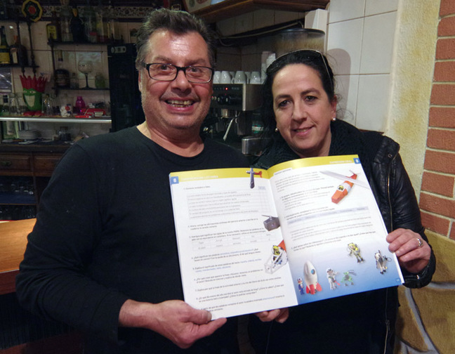 Tito and his missus holding the textbook