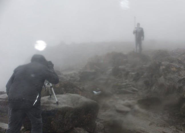 Two OS operatives atop Ben Nevis in foul weather. Pic: Ordnance Survey