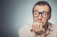 Biting nails photo via Shutterstock