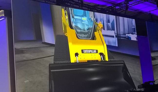 A virtual construction vehicle on stage at Build A virtual construction vehicle on stage at Build