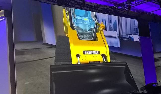 A virtual construction vehicle on stage at Build