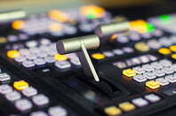 Large leaver switch on a board of push button switches