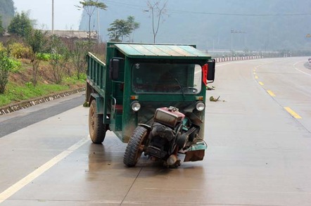 Small truck skids towards side of road as wheel comes loose. Photo by shutterstock