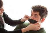 Tape over mouth, image via Shutterstock