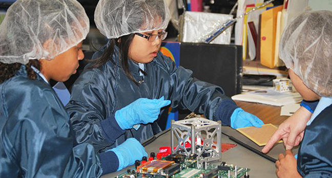 St. Thomas More Cathedral School work on their CubeSat. Pic: NASA