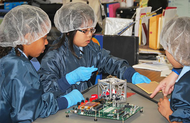 St. Thomas More Cathedral School work on their CubeSat. Pic: NASA