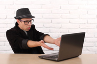 Laptop user, photo via Shutterstock