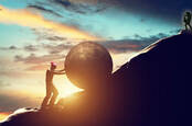 guitar player on shuttertsock photo of (sisyphus) man rolling a rock up a hill. photo by SHutterstock/PHOTOCREO Michal Bednarek