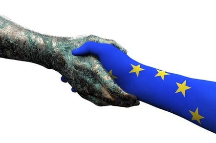 Hand painted with EU flag shakes robot hand. Photo by Shutterstock